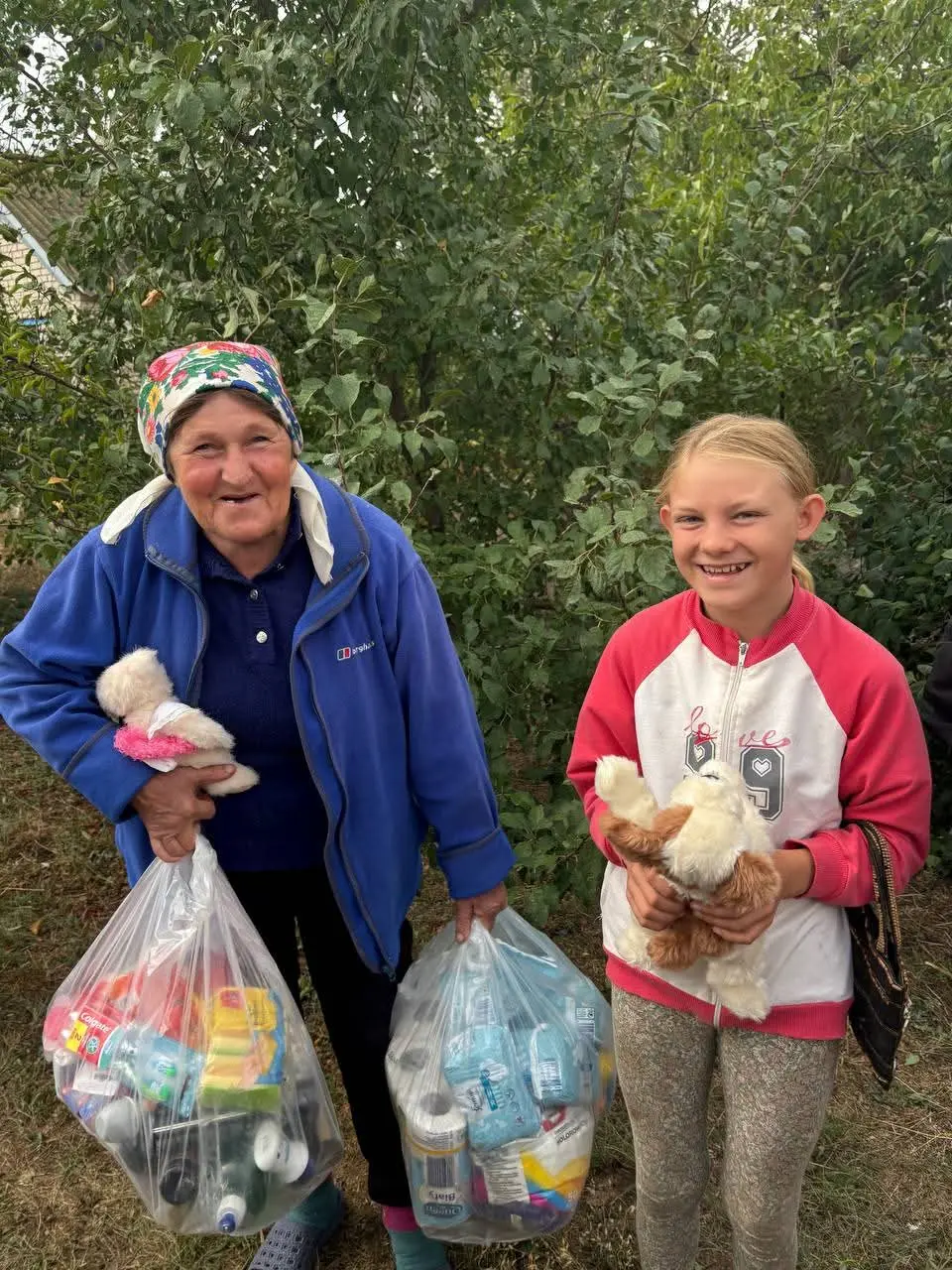 Grandma and granddaughter receiving aid